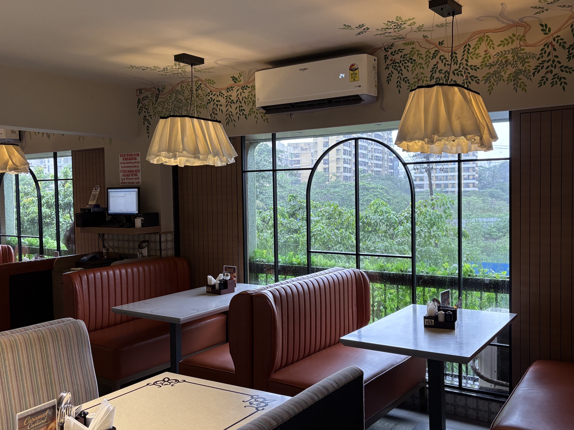 Family AC dining beside the arched windows